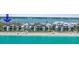 Beachfront condos with manicured lawns leading to a sandy beach on the gulf at 2950 N Beach Rd # B324, Englewood, FL 34223