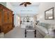 Open-concept living room with high ceilings, and comfortable seating, flowing into the dining area at 2950 N Beach Rd # B324, Englewood, FL 34223