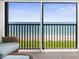 Sliding glass doors show the beautiful ocean view from the lanai at 2950 N Beach Rd # B324, Englewood, FL 34223