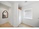 Bright bathroom featuring a shower with white curtain and window at 2957 Montgomery Dr, Port Charlotte, FL 33981