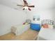 Twin bedroom features tiled floors and coastal-inspired decor at 2957 Montgomery Dr, Port Charlotte, FL 33981