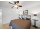 Comfortable bedroom features a ceiling fan, closet, and tiled flooring at 2957 Montgomery Dr, Port Charlotte, FL 33981