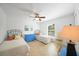Bedroom featuring twin beds, blue dresser, and natural light at 2957 Montgomery Dr, Port Charlotte, FL 33981