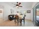 Cozy dining area with a sofa, table, and chairs, near a window and sliding glass doors to the pool at 2957 Montgomery Dr, Port Charlotte, FL 33981