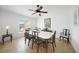Formal dining room with tile flooring, a ceiling fan, and a window offering natural light at 2957 Montgomery Dr, Port Charlotte, FL 33981