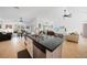Open concept kitchen with stainless steel appliances, kitchen island, and seamless connection to the living area at 2957 Montgomery Dr, Port Charlotte, FL 33981