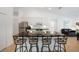 Modern kitchen featuring sleek black countertops, stainless steel appliances, and barstool seating at 2957 Montgomery Dr, Port Charlotte, FL 33981