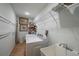Well-equipped laundry room with washer, dryer, utility sink, and storage at 2957 Montgomery Dr, Port Charlotte, FL 33981