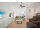 Inviting living room with tile flooring, a ceiling fan, and neutral-toned furniture at 2957 Montgomery Dr, Port Charlotte, FL 33981