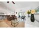 Bright living room featuring tile floors, a ceiling fan, and sliding glass doors to the lanai at 2957 Montgomery Dr, Port Charlotte, FL 33981