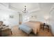 Serene main bedroom with tile floors, tray ceiling, and a comfortable seating area at 2957 Montgomery Dr, Port Charlotte, FL 33981