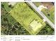 This aerial view shows the property lines, surrounding roads, and nearby structures at 2957 Montgomery Dr, Port Charlotte, FL 33981