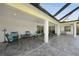 Spacious covered patio featuring comfortable seating and a ceiling fan for warm days at 2957 Montgomery Dr, Port Charlotte, FL 33981
