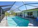 This in-ground pool, patio, and screened-in enclosure offer the perfect outdoor living and entertainment at 2957 Montgomery Dr, Port Charlotte, FL 33981
