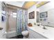Well-lit bathroom with a shower and bathtub combination, a toilet, and vanity at 311 Boundary Blvd, Rotonda West, FL 33947