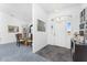 Bright foyer featuring an elegant chandelier and views of the dining room and front door at 311 Boundary Blvd, Rotonda West, FL 33947