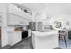 Well-lit, spacious kitchen with stainless steel appliances, white cabinets, and a large island at 311 Boundary Blvd, Rotonda West, FL 33947