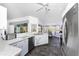 Lovely kitchen with stainless steel appliances, white cabinets, and a breakfast nook overlooking the pool at 311 Boundary Blvd, Rotonda West, FL 33947