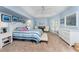 Spacious main bedroom with a tray ceiling, seating area, and a king-size bed at 311 Boundary Blvd, Rotonda West, FL 33947