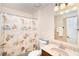 Bathroom featuring a vanity with a granite top, a shower/tub, and neutral decor at 3593 Birmingham Ln, North Port, FL 34288