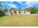Charming one-story home with a well-manicured lawn and mature landscaping in a desirable neighborhood at 3593 Birmingham Ln, North Port, FL 34288