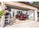 Spacious garage with ample storage, showcasing a parked car and organized shelving with a convenient door to the house at 3593 Birmingham Ln, North Port, FL 34288