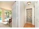 Hallway view of screened lanai with pool, and bathroom at 3593 Birmingham Ln, North Port, FL 34288