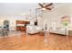Open floor plan showcasing the living room and kitchen area, featuring wood floors and neutral walls at 3593 Birmingham Ln, North Port, FL 34288