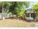 Relaxing screened-in pool area surrounded by mature palm trees, providing a tropical oasis for outdoor enjoyment at 3593 Birmingham Ln, North Port, FL 34288