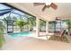 Inviting pool area with a screened enclosure, offering privacy and a tropical ambiance at 3593 Birmingham Ln, North Port, FL 34288