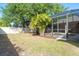 A screened-in pool area with lush greenery, offering a private and serene outdoor retreat at 3593 Birmingham Ln, North Port, FL 34288