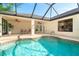 Beautiful private pool surrounded by a screened enclosure, offering a relaxing outdoor space at 3593 Birmingham Ln, North Port, FL 34288