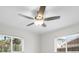 Bright bedroom featuring a ceiling fan, neutral walls, and natural light from the windows at 360 E Wentworth Cir, Englewood, FL 34223