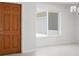 Light-filled foyer featuring a wood-look door, tiled floors, and a window at 360 E Wentworth Cir, Englewood, FL 34223