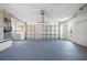 Open garage space with washer, dryer, and ample room for parking and storage solutions at 360 E Wentworth Cir, Englewood, FL 34223