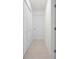 Hallway with tile floors and closet provides access to other rooms of the home at 360 E Wentworth Cir, Englewood, FL 34223