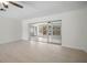 Bright living room featuring sleek sliding doors that provide lots of natural light at 360 E Wentworth Cir, Englewood, FL 34223