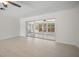 Bright living room featuring sleek sliding doors that provide lots of natural light at 360 E Wentworth Cir, Englewood, FL 34223