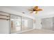 Bright sunroom with tile floors, large windows, and sliding doors to other rooms of the home at 360 E Wentworth Cir, Englewood, FL 34223