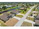 Aerial view of home near a road and community with water features at 39 Medalist Ln, Rotonda West, FL 33947
