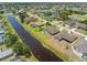 Stunning aerial view of waterfront community highlighting homes nestled along winding canals at 39 Medalist Ln, Rotonda West, FL 33947