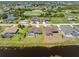 Panoramic aerial of a neighborhood near a lake and golf course with beautiful residences and water views at 39 Medalist Ln, Rotonda West, FL 33947