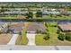 Beautiful aerial view of a landscaped home near a canal, offering a serene waterfront lifestyle at 39 Medalist Ln, Rotonda West, FL 33947