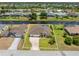Aerial view of a beautiful property featuring a private pool, spacious lawn, and a serene canal backdrop at 39 Medalist Ln, Rotonda West, FL 33947