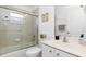 Well-lit bathroom features a glass enclosed shower, vanity, and toilet at 39 Medalist Ln, Rotonda West, FL 33947