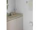 Bathroom vanity with white cabinets and marble-style countertop, adding elegance to this inviting home at 39 Medalist Ln, Rotonda West, FL 33947