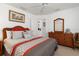 Bedroom featuring a dresser with mirror, wicker chair, and closet space at 39 Medalist Ln, Rotonda West, FL 33947