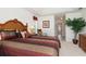 Comfortable primary bedroom with large window and decorative accents at 39 Medalist Ln, Rotonda West, FL 33947