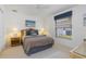 Cozy bedroom featuring a ceiling fan, window with blinds, and closet space at 39 Medalist Ln, Rotonda West, FL 33947