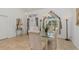 Dining room features a glass table, tile flooring, and natural lighting at 39 Medalist Ln, Rotonda West, FL 33947